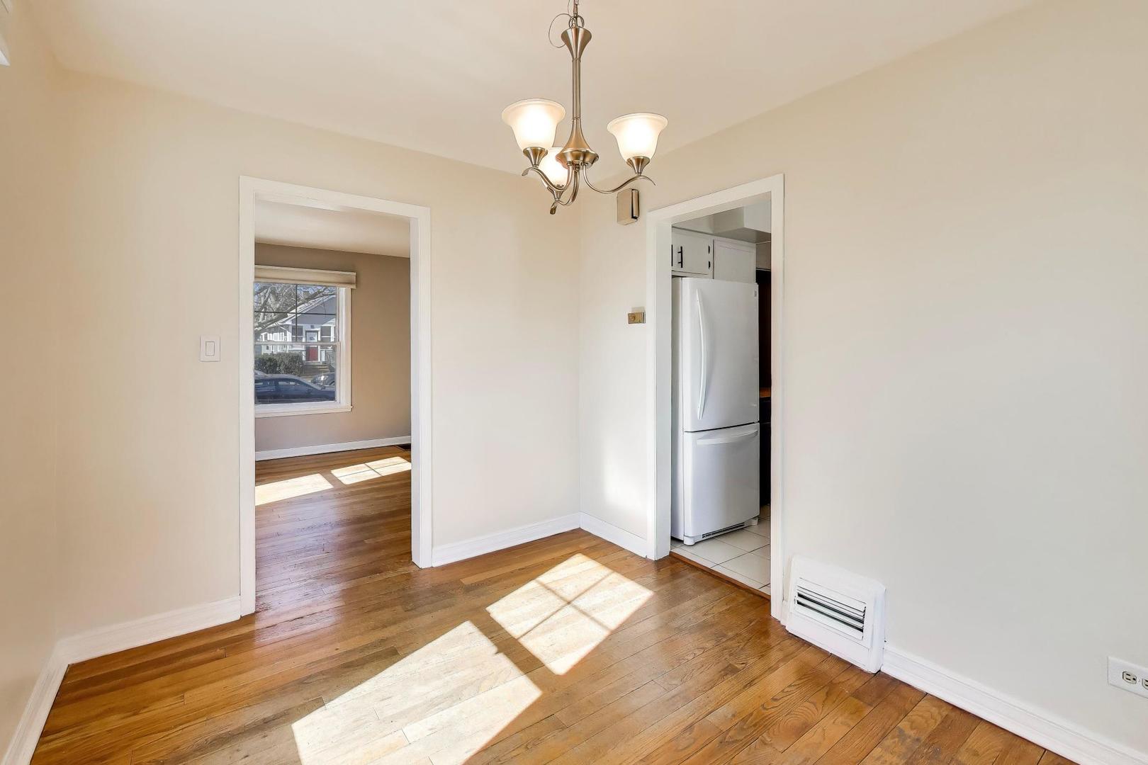 4023 Oak Avenue Brookfield, IL 60513 - Photo 5 of 17 a view of a livingroom with wooden floor and a ceiling fan
