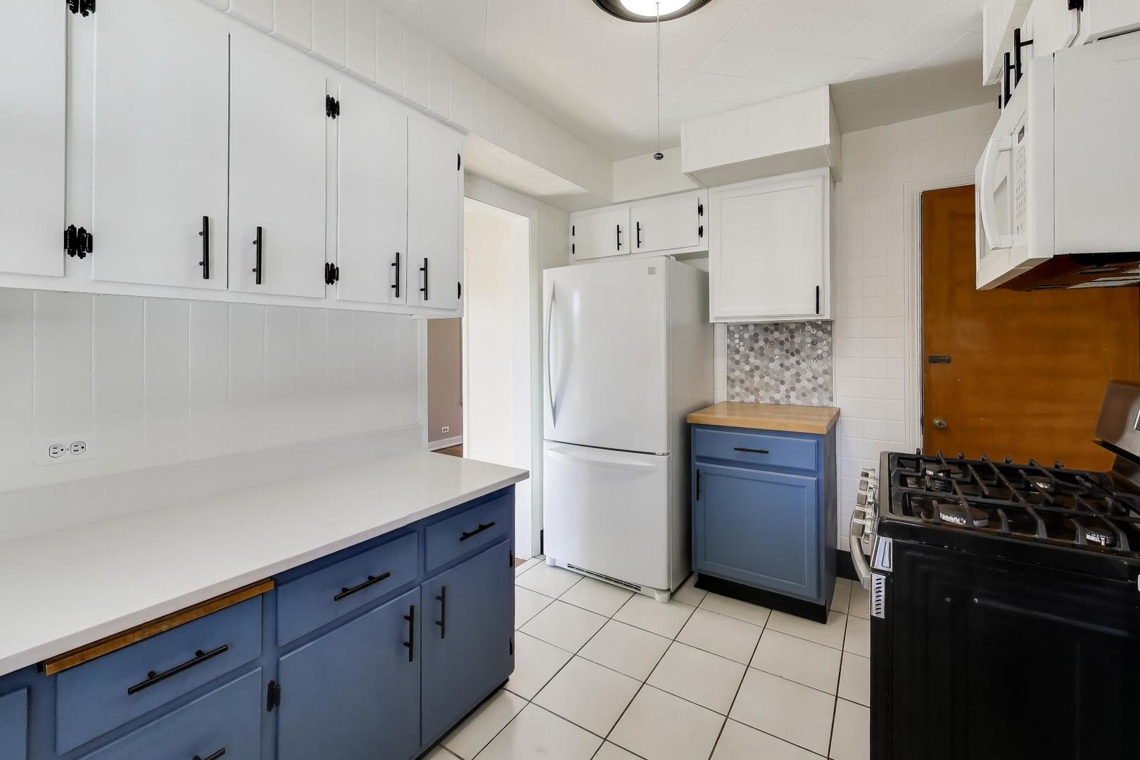 4023 Oak Avenue Brookfield, IL 60513 - Photo 7 of 17 a kitchen with a refrigerator and a stove