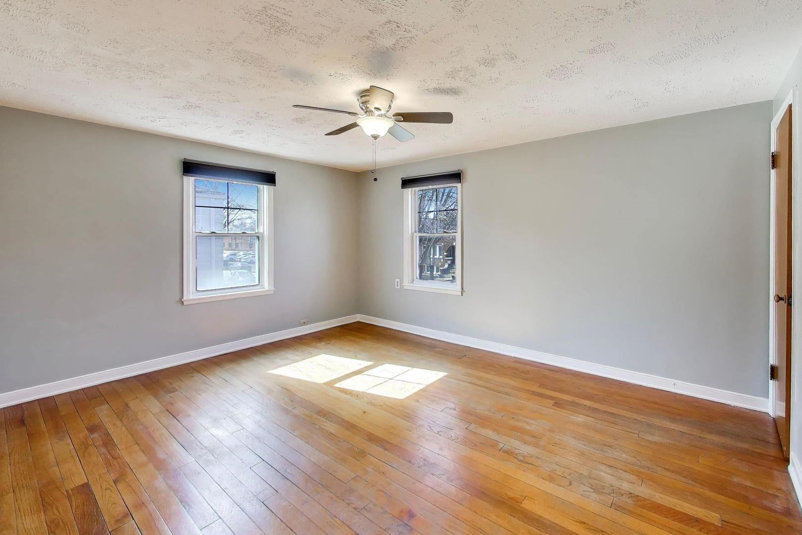 4023 Oak Avenue Brookfield, IL 60513 - Photo 8 of 17 a view of an empty room with wooden floor and a window