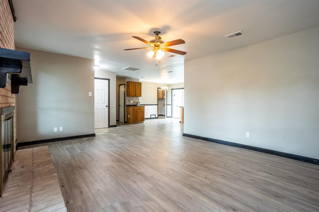 1206 Oakbluff Drive Lancaster, TX 75146 - Photo 5 of 23 Looking toward the dining area with a built-in cabinet and door to laundry room