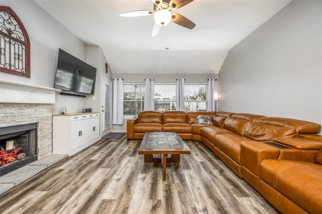 a bedroom with a bed and a fireplace