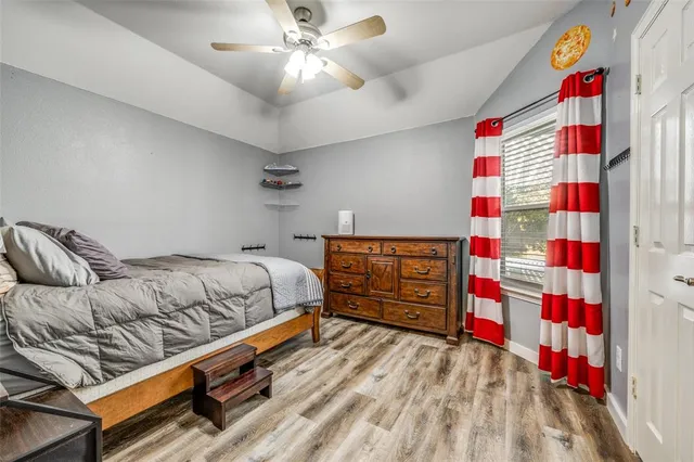 a bedroom with furniture and windows