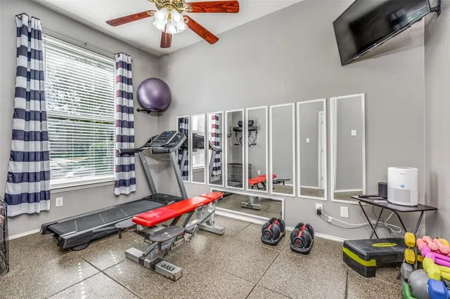 a bedroom with furniture and a wooden floor