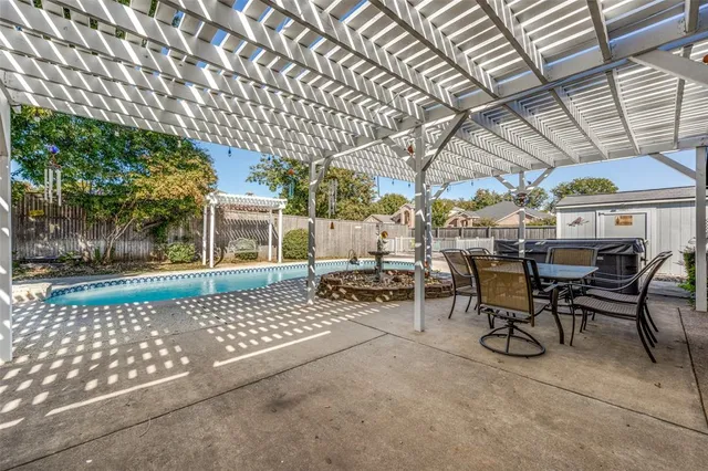 a view of a swimming pool with a patio