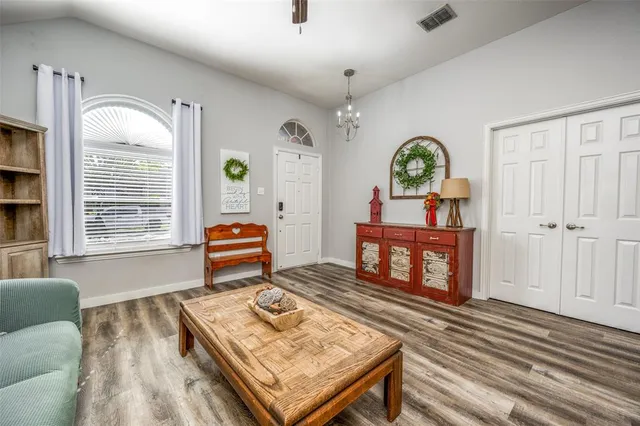 a living room with furniture and a window