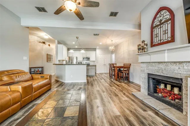 a living room with furniture and a fireplace
