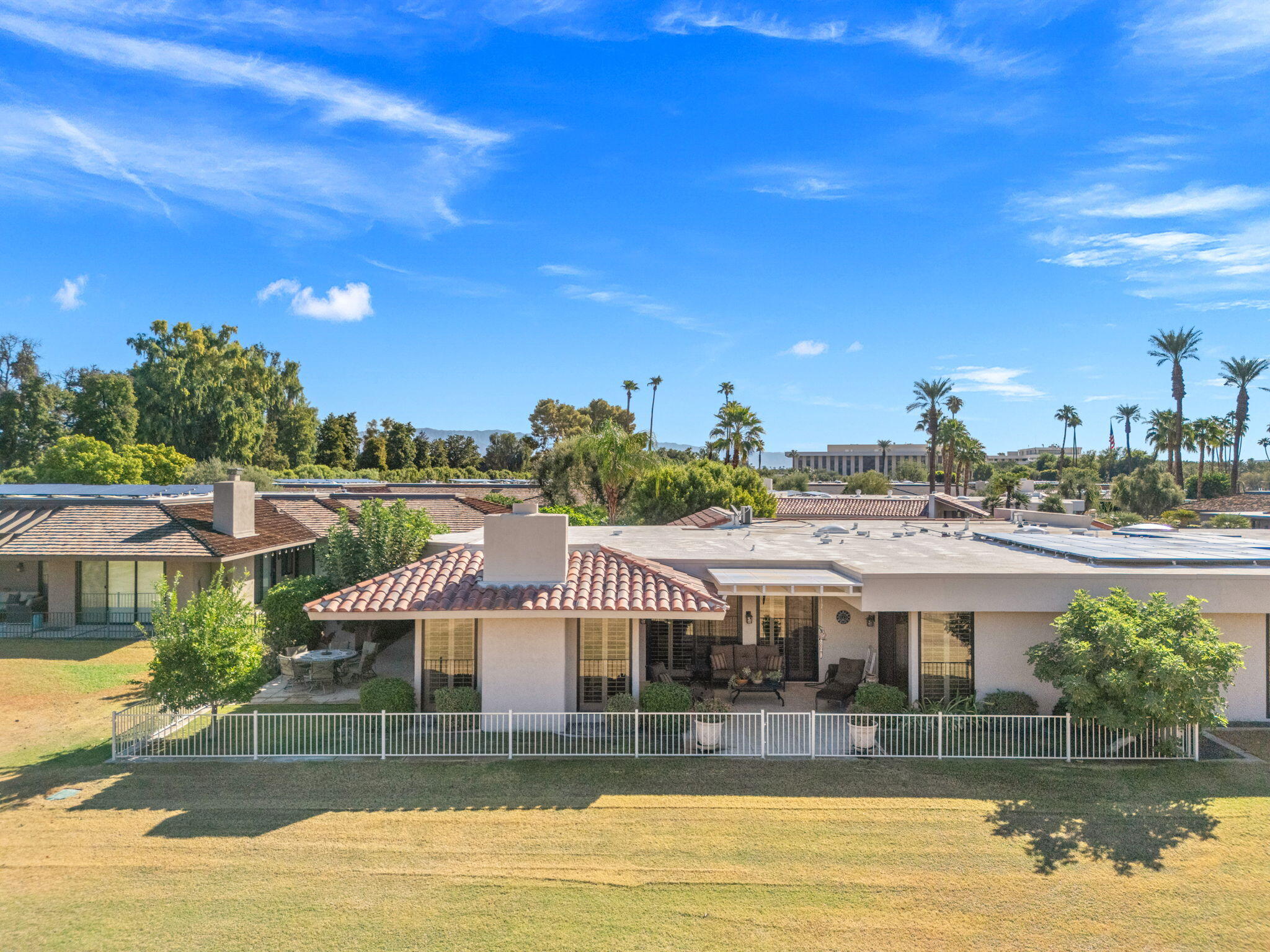 10 Whittier Court Rancho Mirage, CA 92270 - Photo 12 of 88 a view of a swimming pool with seating space