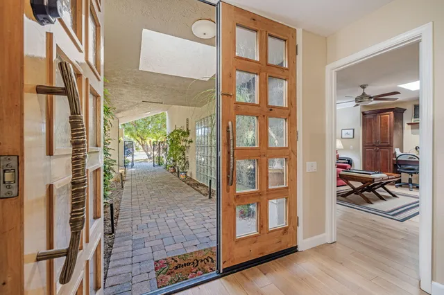 a dining room with furniture window and wooden floor