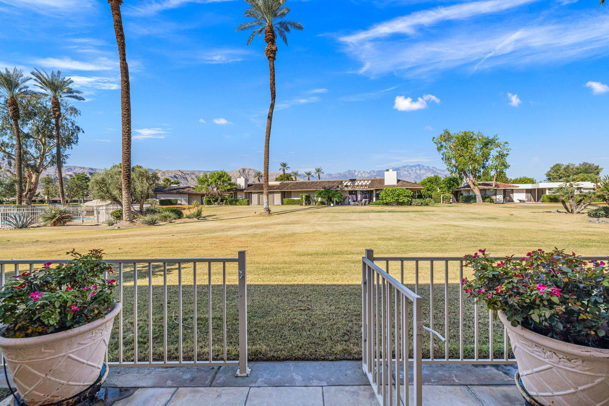 10 Whittier Court Rancho Mirage, CA 92270 - Photo 20 of 88 a view of a balcony and dining space with furniture