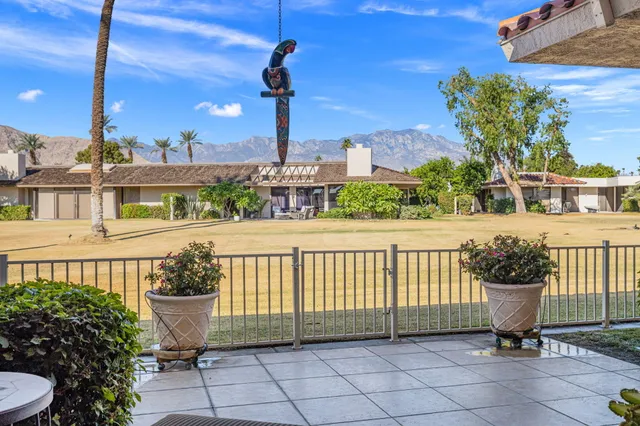 a bedroom with a bed and large window