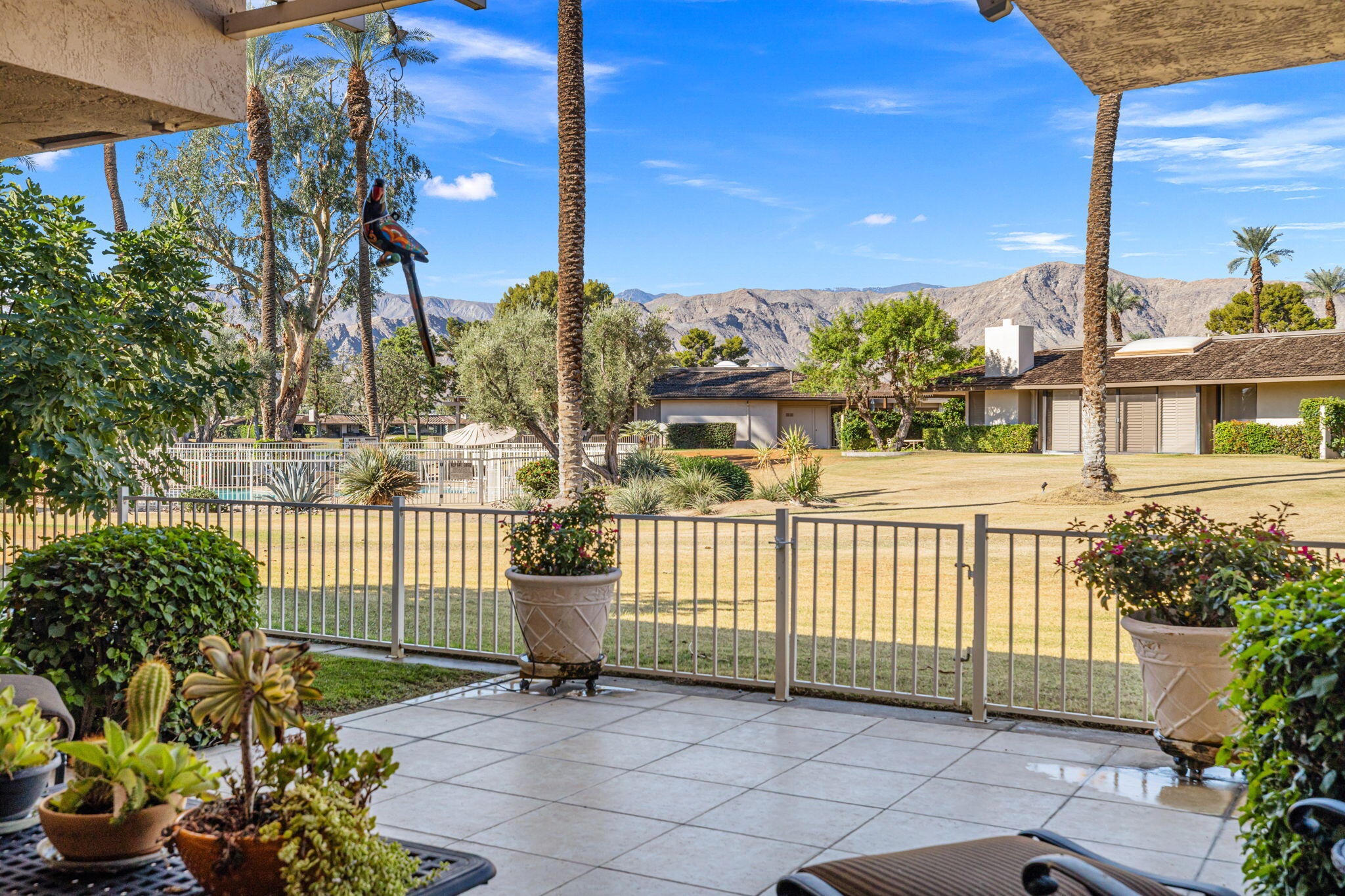 10 Whittier Court Rancho Mirage, CA 92270 - Photo 32 of 88 a view of a porch with a bench