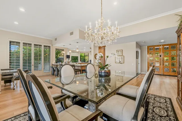 a bedroom with a bed couch and a window