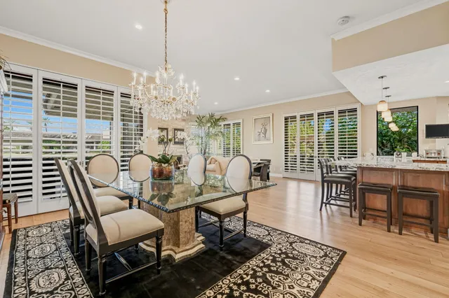 a view of a swimming pool with a table and chairs