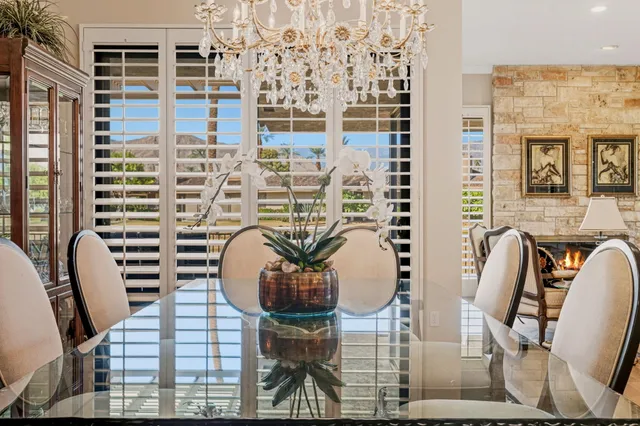 a view of house with yard swimming pool and outdoor seating