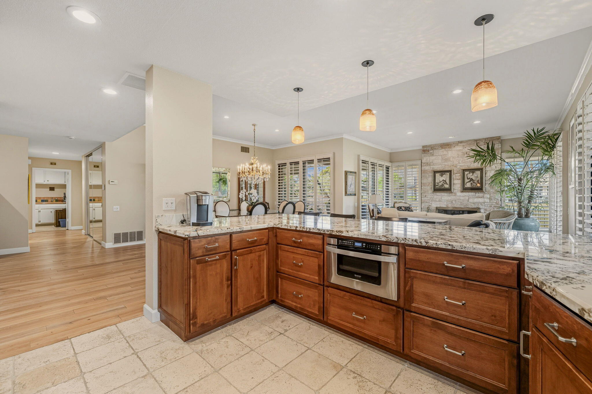 10 Whittier Court Rancho Mirage, CA 92270 - Photo 43 of 88 a kitchen with stainless steel appliances granite countertop a sink and cabinets