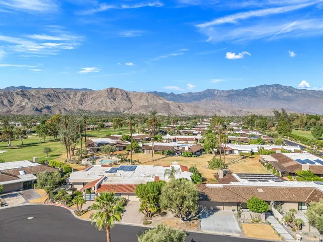 a view of a swimming pool with seating space