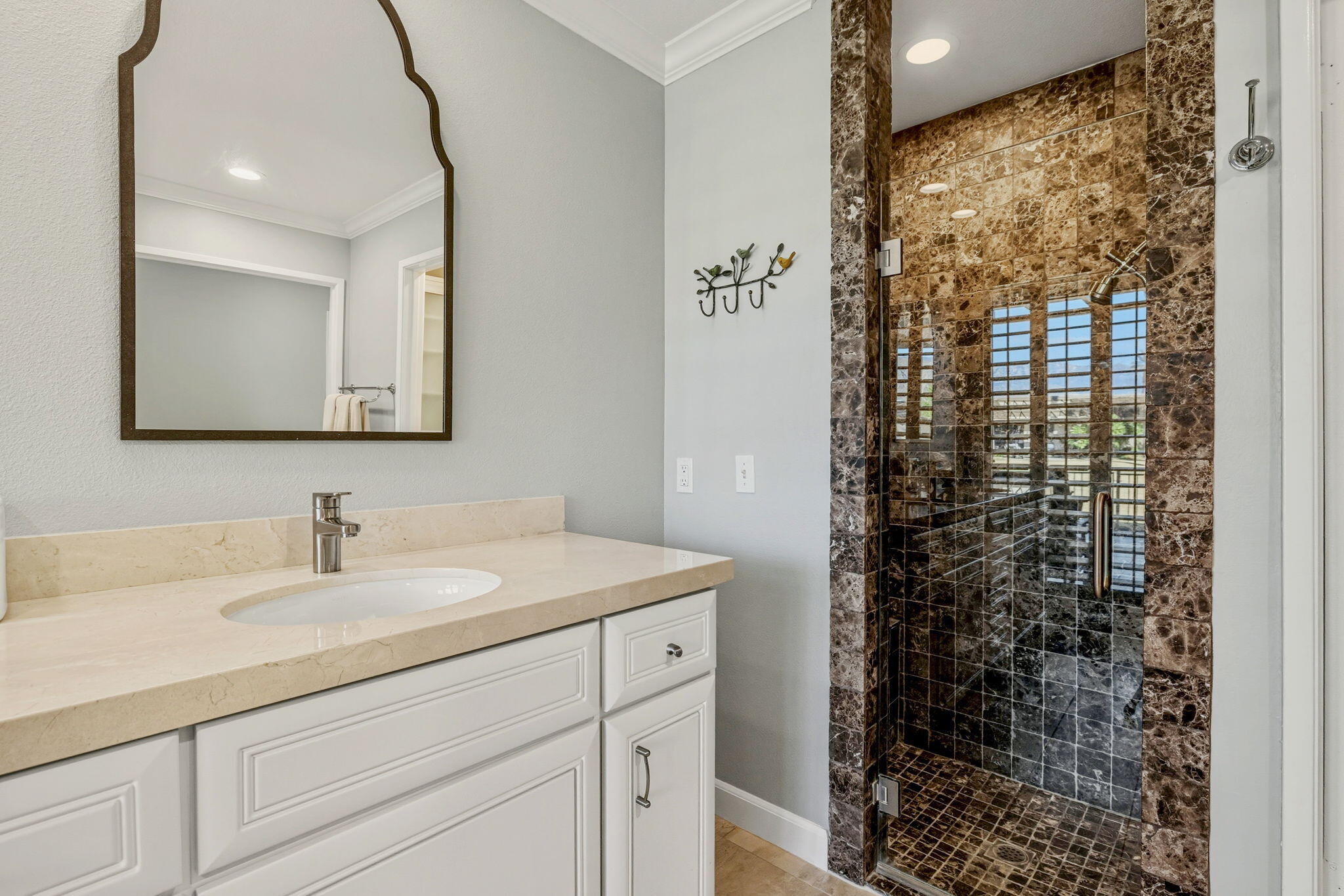 10 Whittier Court Rancho Mirage, CA 92270 - Photo 60 of 88 a bathroom with a sink a vanity and a shower