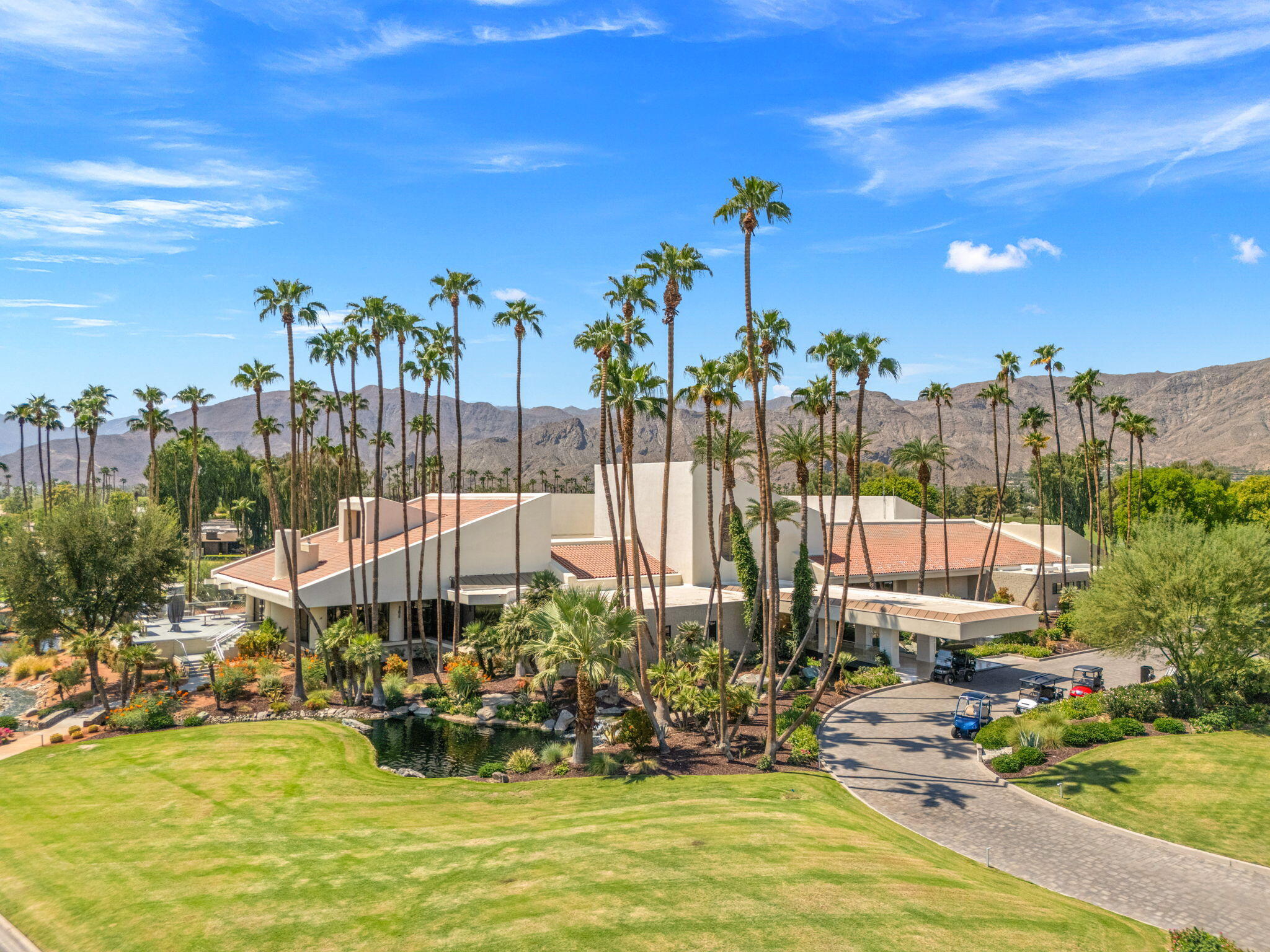 10 Whittier Court Rancho Mirage, CA 92270 - Photo 70 of 88 a view of a lake with a house