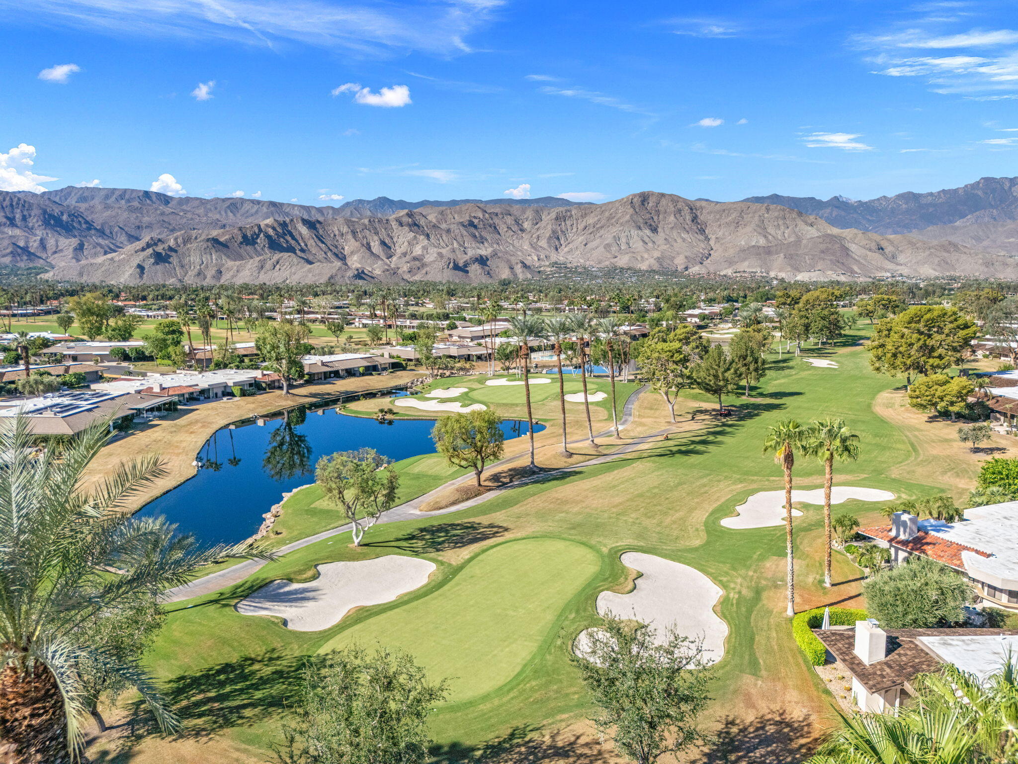 10 Whittier Court Rancho Mirage, CA 92270 - Photo 8 of 88 a view of a swimming pool with mountains in the background