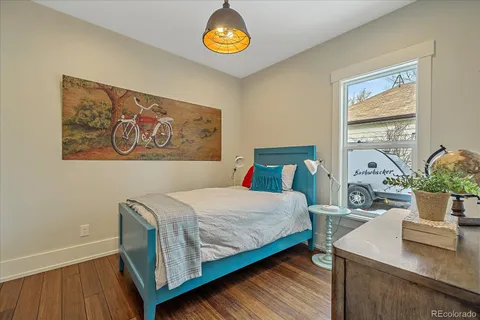 a bedroom with a bed and a table