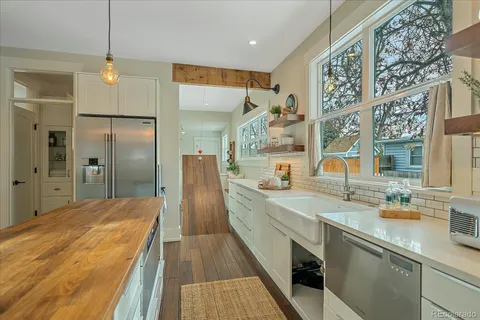 a spacious bathroom with a double vanity sink and a mirror