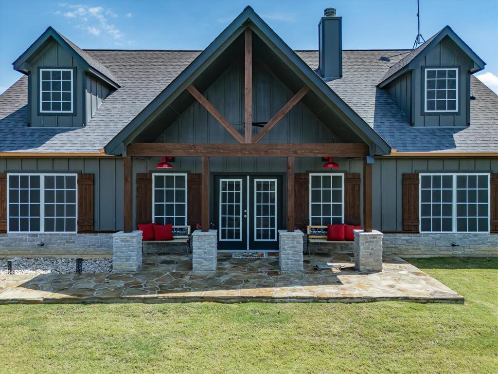 117 Ranchview Court Bowie, TX 76230 - Photo 2 of 40 a front view of a house with swimming pool and porch