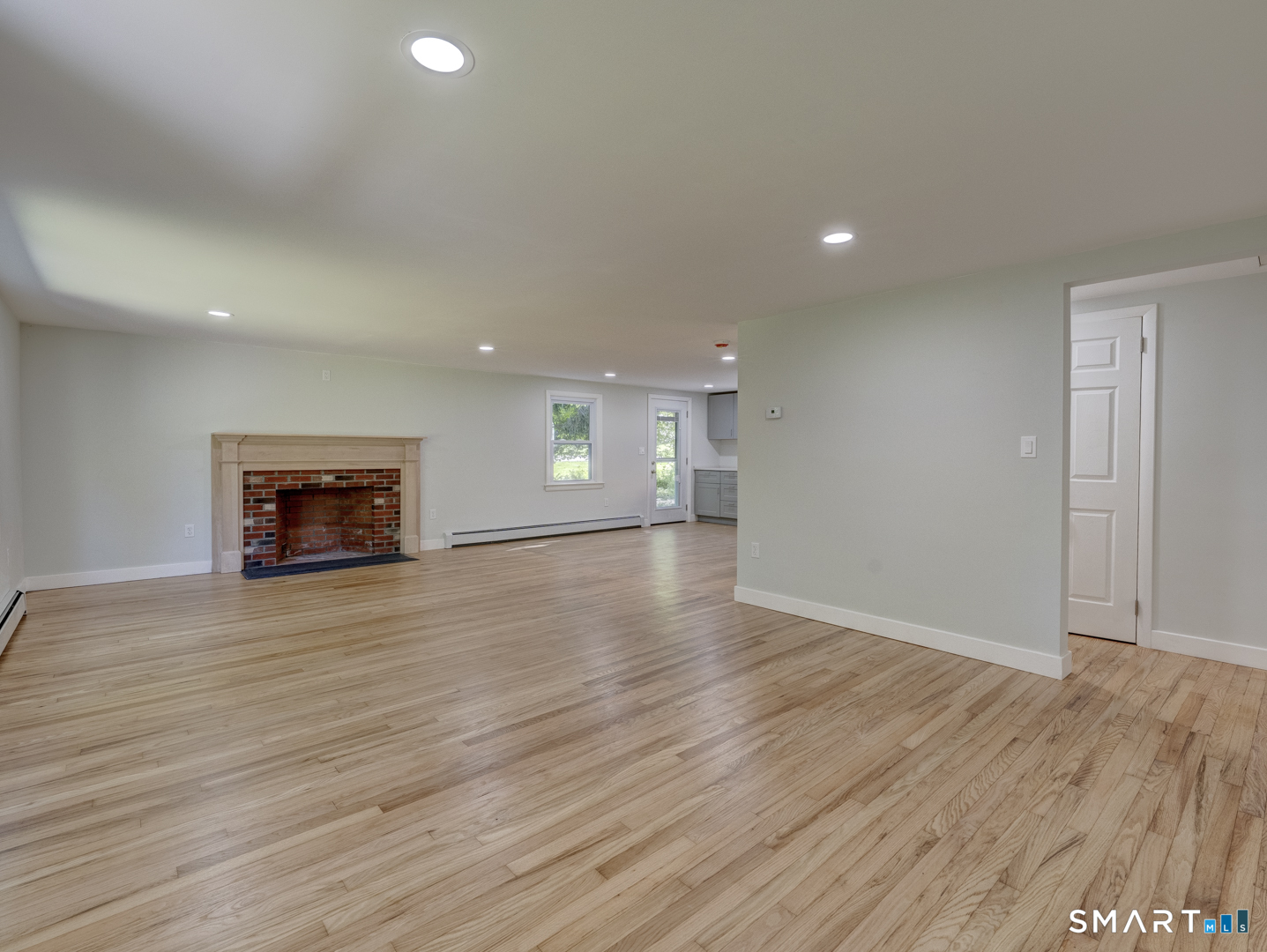 70 Doubleday Road Columbia, CT 06237 - Photo 13 of 39 Look at these gleaming hardwood floors, Large Living Room that opens into the kitchen.