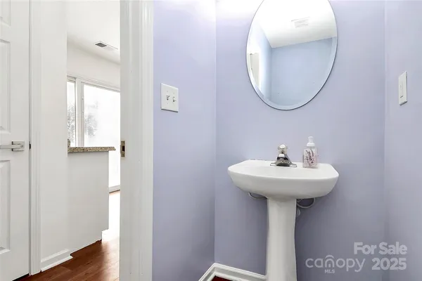a bathroom with a sink a mirror and shower