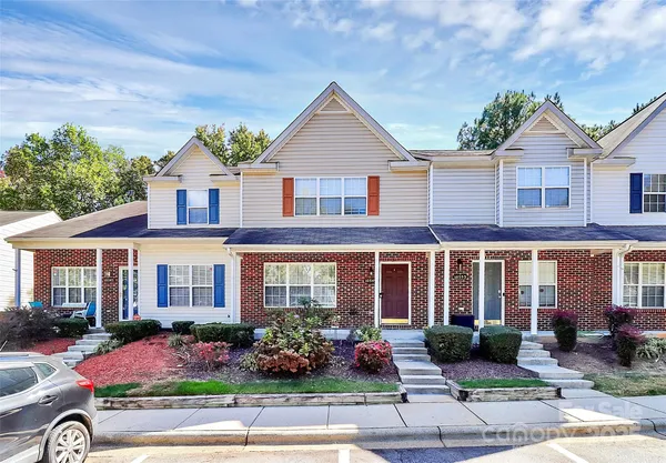 a front view of a house with yard