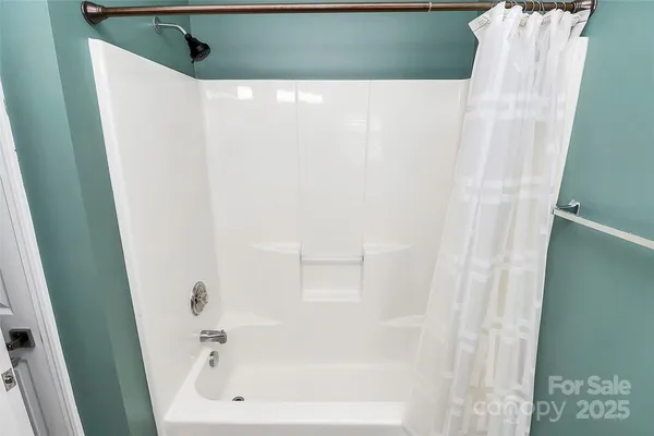 a bathroom with a white tub