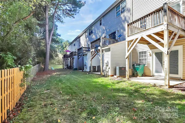 a view of a house with a yard and deck