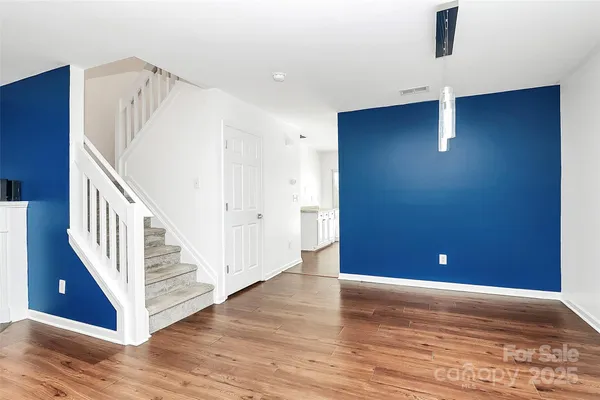 a view of a livingroom with wooden floor