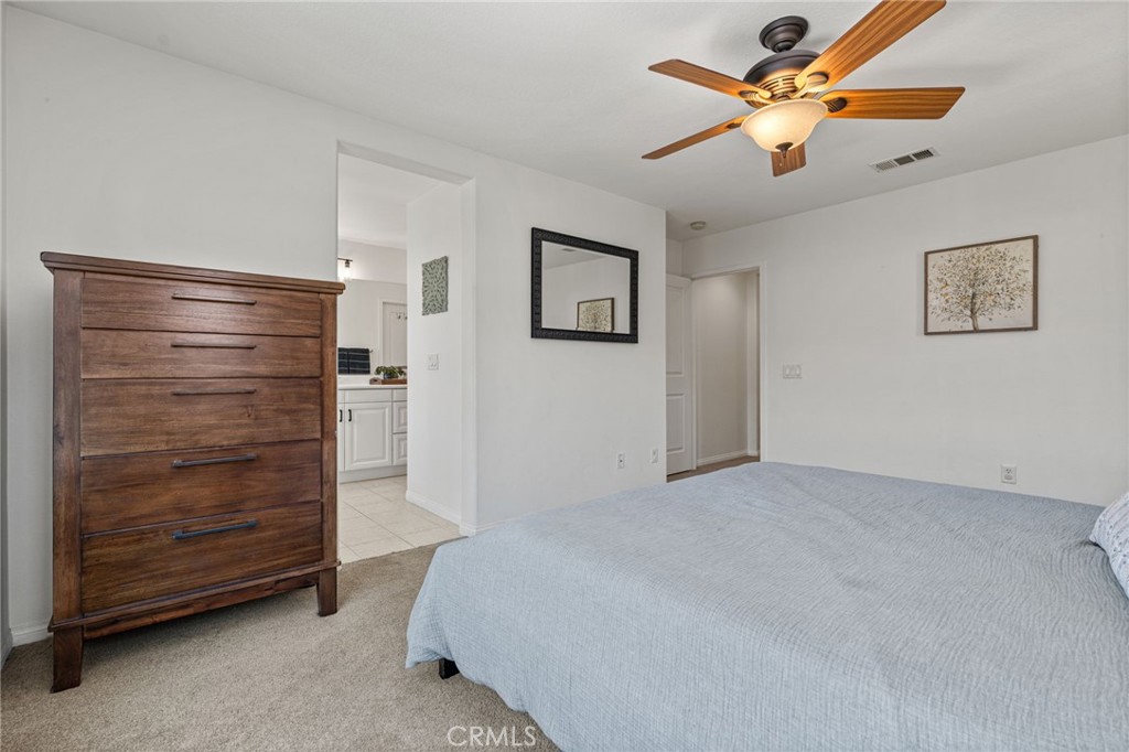 28356 Santa Rosa Lane Saugus, CA 91350 - Photo 12 of 50 a bedroom with a bed and a ceiling fan