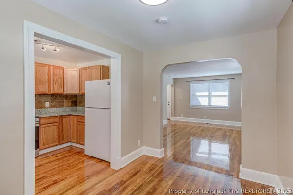 a kitchen with a stove a sink and a microwave