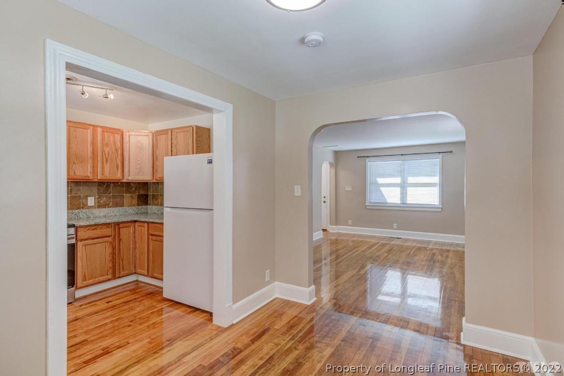 2710 Broad Street Durham, NC 27704 - Photo 13 of 36 a view of a kitchen with a sink dishwasher and a refrigerator