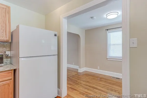 a bathroom with a sink a mirror and toilet