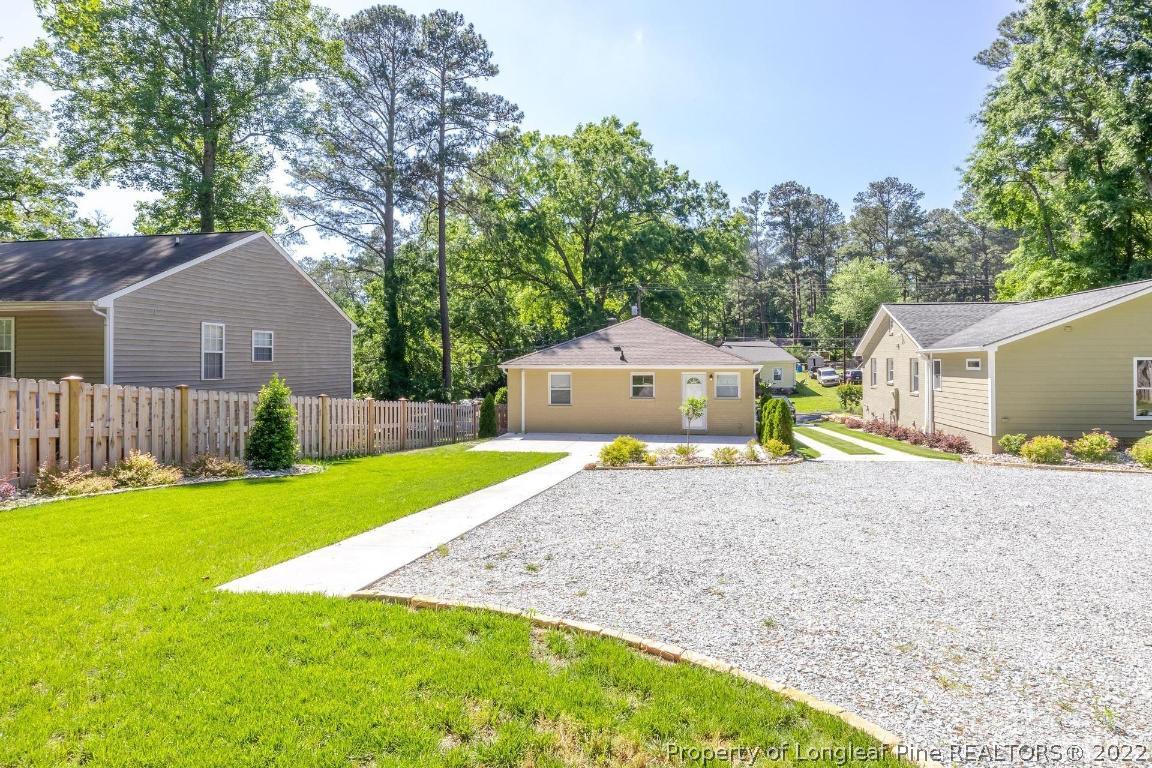 2710 Broad Street Durham, NC 27704 - Photo 33 of 36 a front view of house with yard and trees