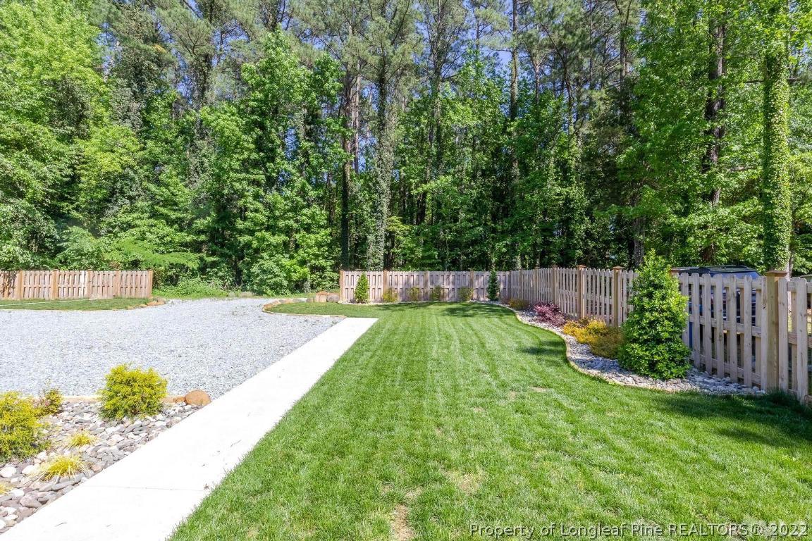 2710 Broad Street Durham, NC 27704 - Photo 36 of 36 a view of a backyard with wooden fence