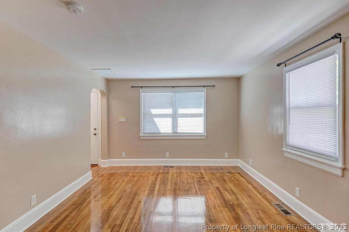 2710 Broad Street Durham, NC 27704 - Photo 9 of 36 a view of an empty room with wooden floor and a window