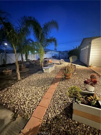 a view of a backyard of the house