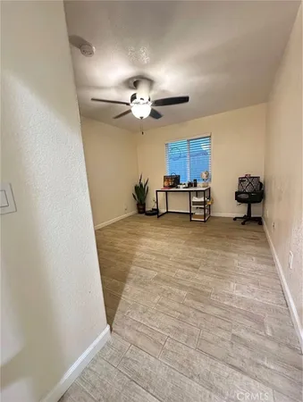 a view of kitchen with furniture and wooden floor