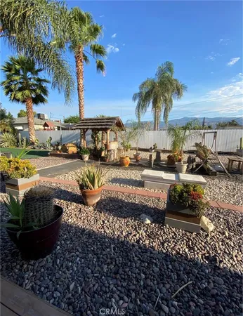 a front view of a house with garden and street view