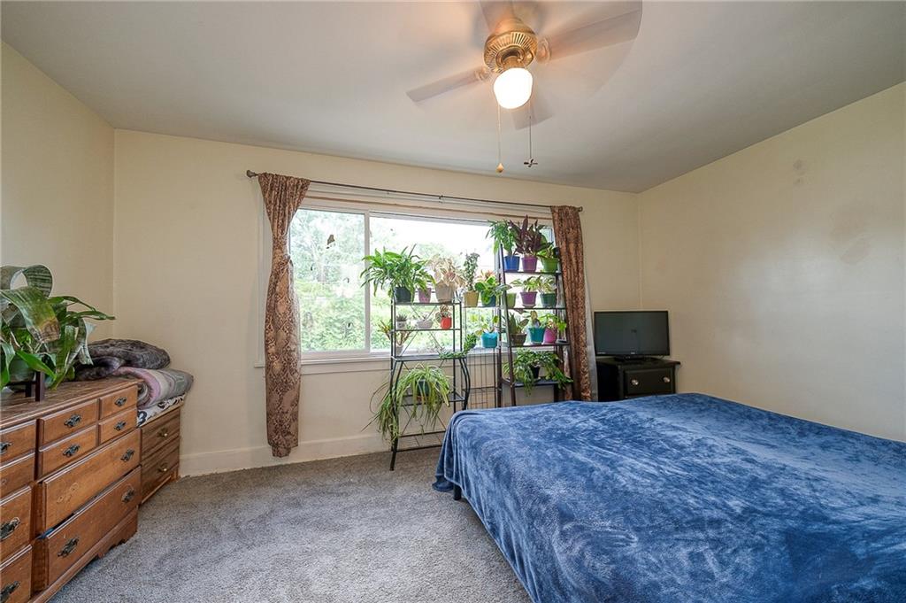 120 Duffield Avenue Pittsburgh, PA 15235 - Photo 14 of 21 a bed room with a bed and a television