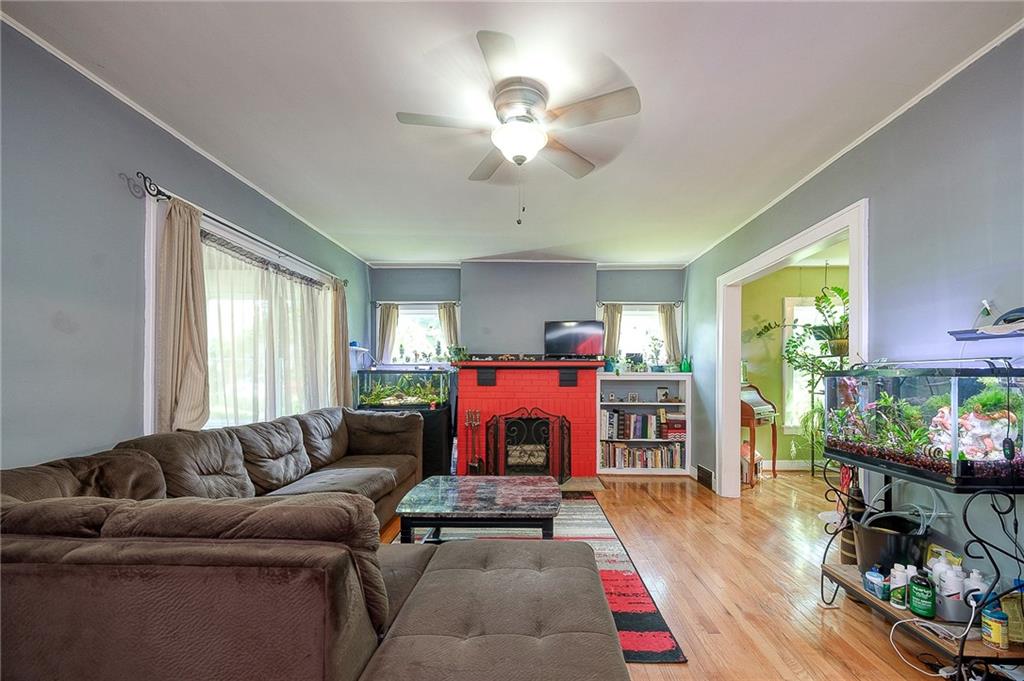 120 Duffield Avenue Pittsburgh, PA 15235 - Photo 4 of 21 a living room with furniture fireplace and flat screen tv
