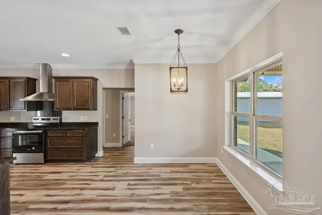 a view of kitchen with granite countertop cabinets and wooden floor