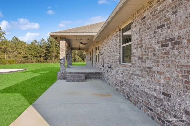 a view of a patio with a garden