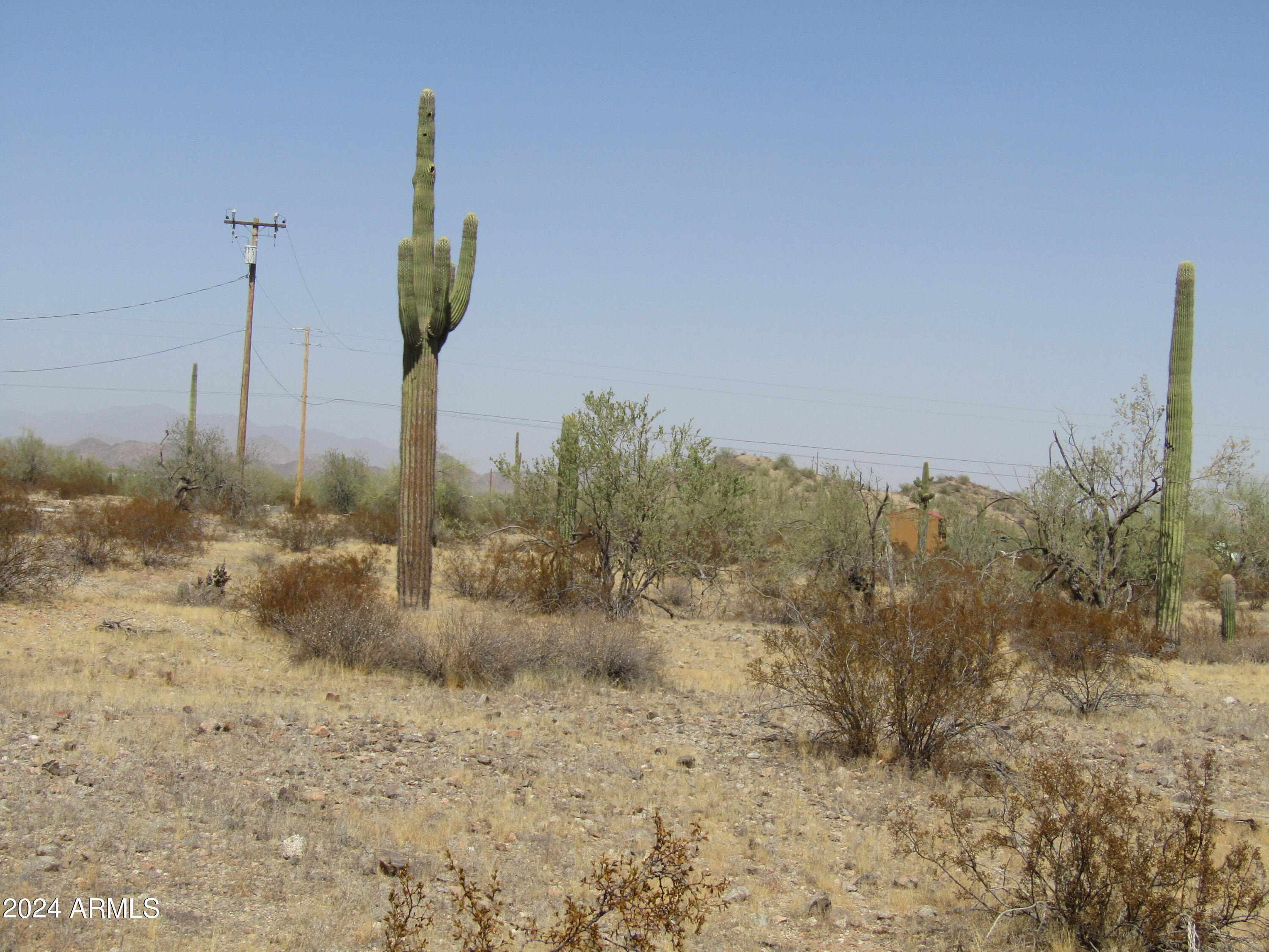 0 West Momoli Road, Unit 24 Maricopa, AZ 85139 - Photo 7 of 11 a view of a road with a view of the trees