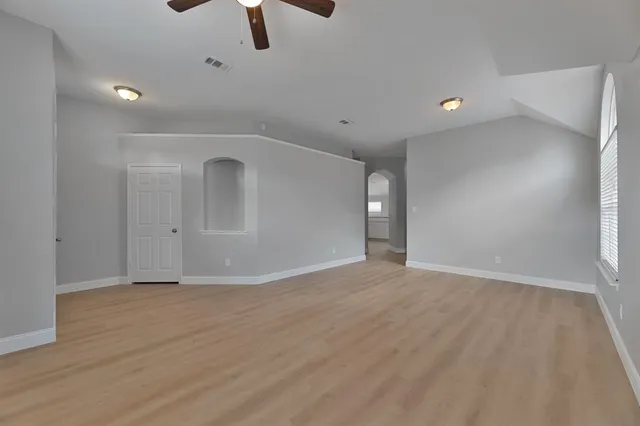 a view of an empty room with a window