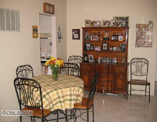 49 Olcott Way, Unit 49 Ridgefield, CT 06877 - Photo 1 of 1 a view of a dining room with furniture