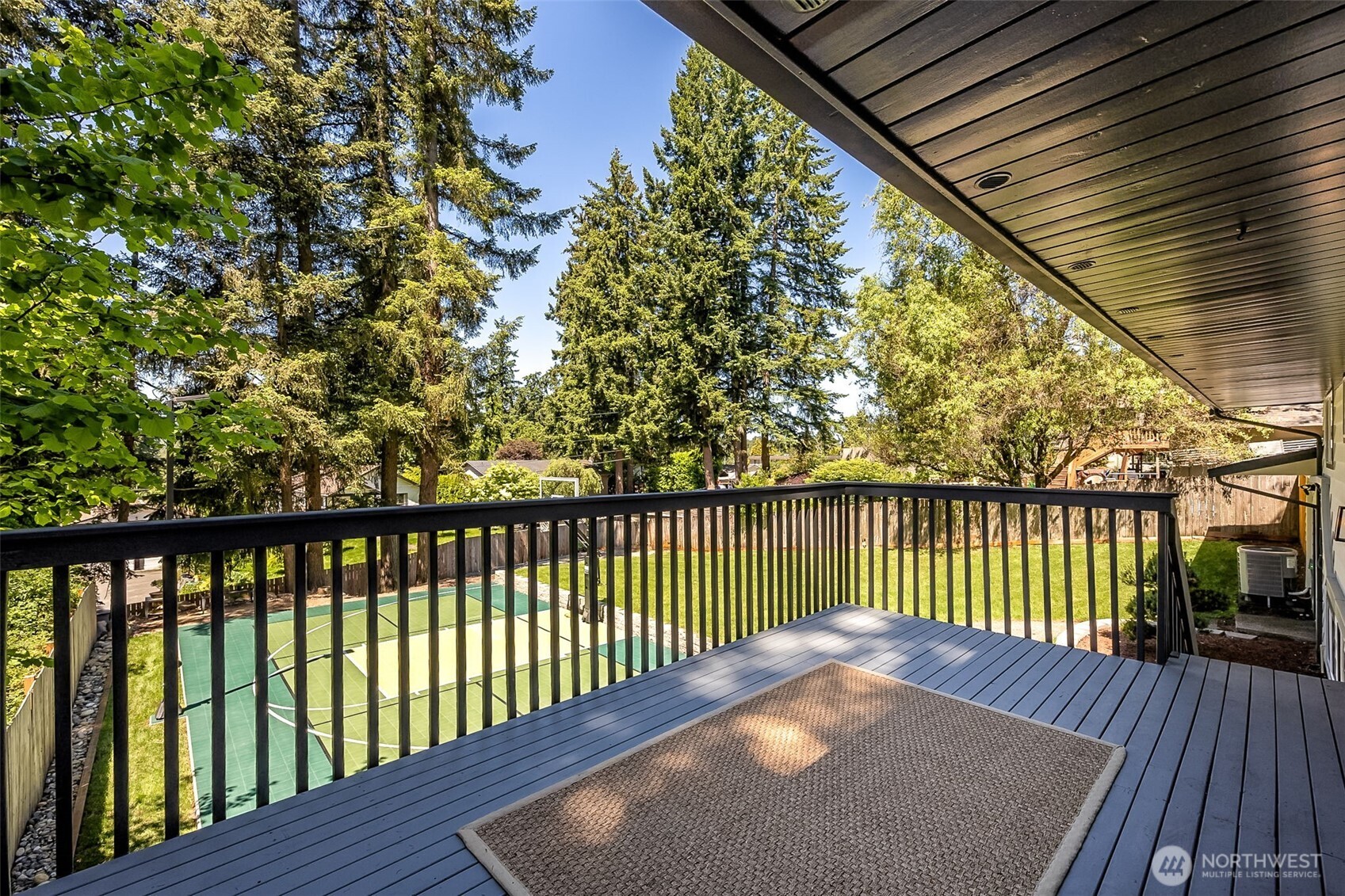 24028 6th Place West Bothell, WA 98021 - Photo 12 of 35 a balcony with trees in front of it